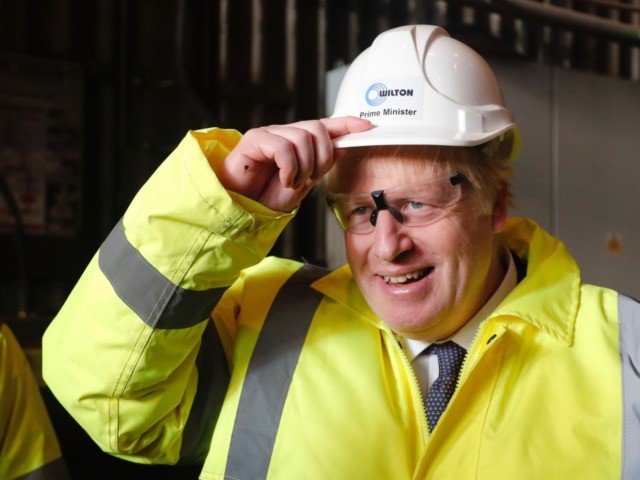 MIDDLESBROUGH, ENGLAND - NOVEMBER 20: Prime Minister Boris Johnson wears a construction helmet with "Prime Minister" written on it, during a visit to Wilton Engineering Services as part of a General Election campaign trail stop on November 20, 2019 in Middlesbrough, England. (Photo by Frank Augstein - WPA Pool/Getty Images)