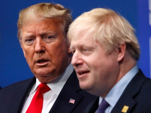 Britain's Prime Minister Boris Johnson (R) welcomes US President Donald Trump (L) to the NATO summit at the Grove hotel in Watford, northeast of London on December 4, 2019. (Photo by PETER NICHOLLS / various sources / AFP) (Photo by PETER NICHOLLS/AFP via Getty Images)