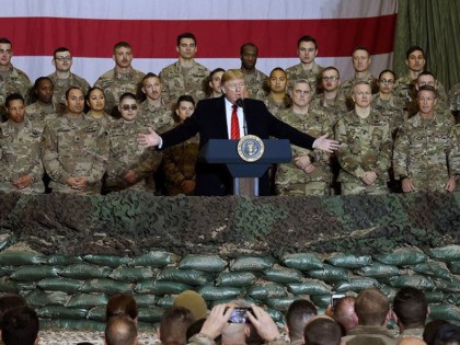 (FILES) In this file photo taken on November 28, 2019, US President Donald Trump speaks to the troops during a surprise Thanksgiving day visit at Bagram Air Field in Afghanistan. - President Donald Trump has shattered through norms and niceties on the world stage in his nearly three years in …
