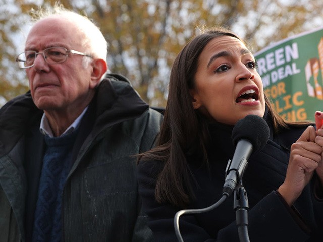 WASHINGTON, DC - NOVEMBER 14: Democratic presidential candidate Sen. Bernie Sanders (I-VT) (L) and Rep. Alexandria Ocasio-Cortez (D-NY) hold a news conference to introduce legislation to transform public housing as part of their Green New Deal proposal outside the U.S. Capitol November 14, 2019 in Washington, DC. The liberal legislators …