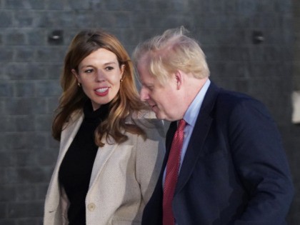 LONDON, ENGLAND - DECEMBER 13: Prime Minister Boris Johnson and his partner Carrie Symonds enter Downing Street as the Conservatives celebrate a sweeping election victory on December 13, 2019 in London, England. Prime Minister Boris Johnson called the first UK winter election for nearly a century in an attempt to …