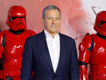 Disney CEO Bob Iger poses on the red carpet with sith stormtroopers upon arrival for the European film premiere of Star Wars: The Rise of Skywalker in London on December 18, 2019. (Photo by Tolga AKMEN / AFP) (Photo by TOLGA AKMEN/AFP via Getty Images)