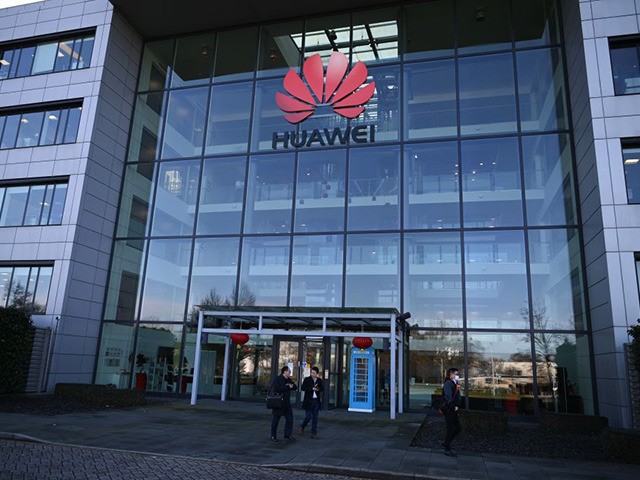 A photograph shows the logo of Chinese company Huawei at their main UK offices in Reading,