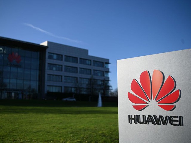 A photograph shows the logo of Chinese company Huawei at their main UK offices in Reading,
