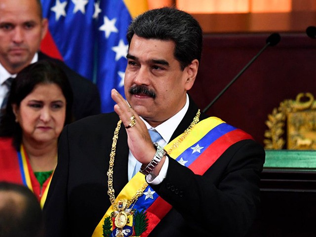 Venezuelan President Nicolas Maduro waves during the opening ceremony of the judicial year