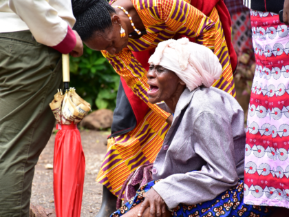 Moshi residents in Kilimanjaro region, north Tanzania, grieve at Mawenzi hospital on February 2, 2020, after the death of her granddaughter who was killed in stampede yesterday at Majengo open ground during the church service where 20 people died and 16 injured rushed to get blessed oil. (Photo by FILBERT …