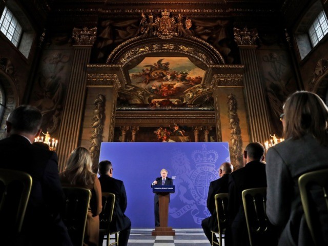 Britain's Prime Minister Boris Johnson reacts as he delivers a speech at the Old Roya