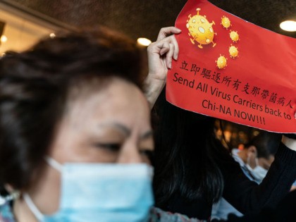 HONG KONG, CHINA - FEBRUARY 03: Protesters hold placards during a rally supporting a strik