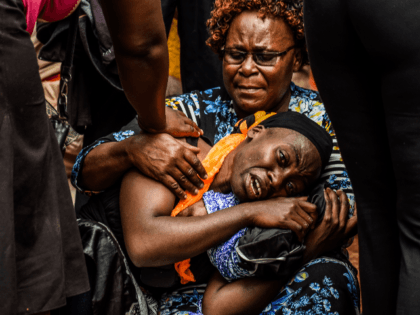 A mother mourns for her dead child at Kakamega Hospital mortuary in western Kenya on February 4, 2020. - 14 pupils lost their lives while 39 others were injured following a stampede at Kakamega Primary School on 3rd February 2020 as the pupils rushed to get home according to the …