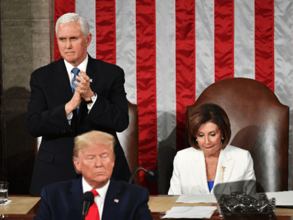 US President Donald Trump delivers the State of the Union address flanked by US Vice President Mike Pence (L) and Speaker of the US House of Representatives Nancy Pelosi (R) at the US Capitol in Washington, DC, on February 4, 2020. (Photo by MANDEL NGAN / AFP) (Photo by MANDEL …