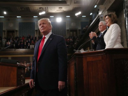 U.S. President Donald Trump arrives as Vice President Mike Pence and Speaker of the House Nancy Pelosi look on prior to delivering his State of the Union address to a joint session of the U.S. Congress in the House Chamber of the U.S. Capitol in Washington, U.S. February 4, 2020. …
