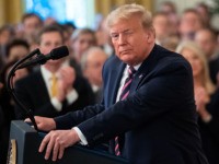 US President Donald Trump winks alongside First Lady Melania Trump as he speaks about his Senate impeachment trial in the East Room of the White House in Washington, DC, February 6, 2020. (Photo by SAUL LOEB / AFP) (Photo by SAUL LOEB/AFP via Getty Images)