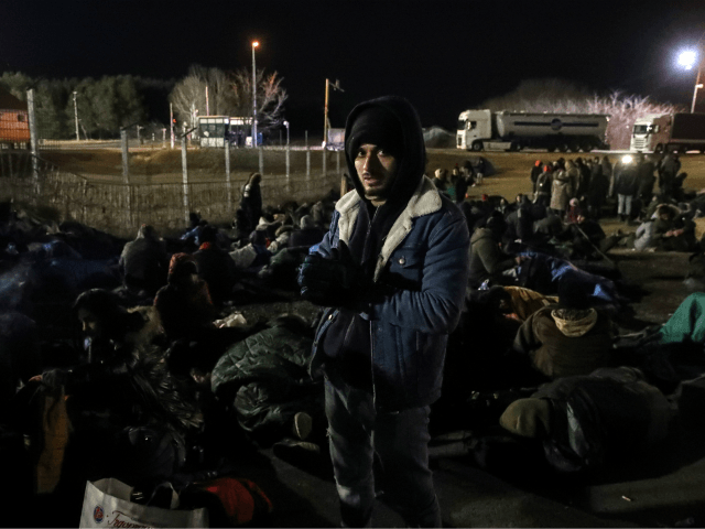 Migrants camp beside the border fence at the Serbian Kelebija border village near Subotica on February 6, 2020, as the Tompa road border-crossing on the Hungarian side has been temporarily closed by the Hungarian police. - Hungarian police temporarily closed a Serbian border crossing on February 6 after a large …