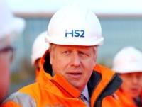 Britain's Prime Minister Boris Johnson reacts during his visit to Curzon Street railway station in Birmingham, central England on February 11, 2020, where the High Speed 2 (HS2) rail project is under construction. - Britain said Tuesday it will begin full construction work on its new high-speed railway line in …