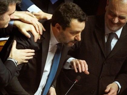 Lega members Gian Marco Centinaio (L) and Roberto Calderoli (R) congratulate Italian Lega party far-right leader Matteo Salvini after he addressed the Senate on February 12, 2020 in Rome, as Italian senators are to decide whether he should face trial on charges of illegally detaining migrants at sea last year. …