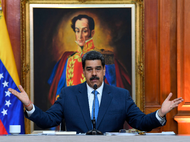 Venezuela's President Nicolas Maduro gestures during a press conference with members of th