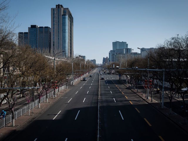 A nearly empty street is seen in Beijing on February 15, 2020. - The death toll from the new coronavirus outbreak jumped past 1,500 in China as France reported the first fatality outside Asia, fuelling global concerns about the epidemic (Photo by NICOLAS ASFOURI / AFP) (Photo by NICOLAS ASFOURI/AFP via Getty Images)