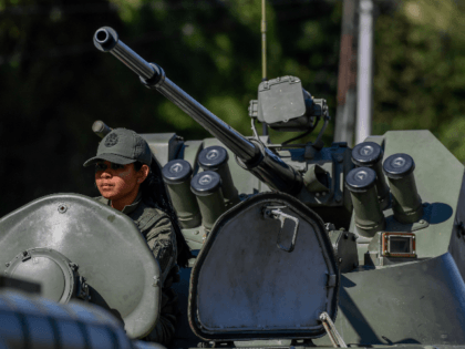A member of the National Guard takes part in military exercises for the 'Bolivarian Shield 2020 Operation' at Metropolitan distributor in Caracas, on February 15, 2020. - The Venezuelan Armed Forces fulfilled Saturday, the first of two days of military exercises in preparation of alleged aggression plans from the United …