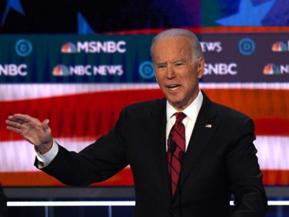 Democratic presidential hopeful former Vice President Joe Biden (R) speaks next to Vermont Senator Bernie Sanders during the ninth Democratic primary debate of the 2020 presidential campaign season co-hosted by NBC News, MSNBC, Noticias Telemundo and The Nevada Independent at the Paris Theater in Las Vegas, Nevada, on February 19, …