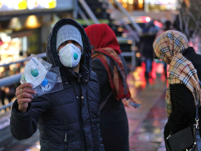 An Iranian street vendor sells protective masks in the capital Tehran on February 20,2020.
