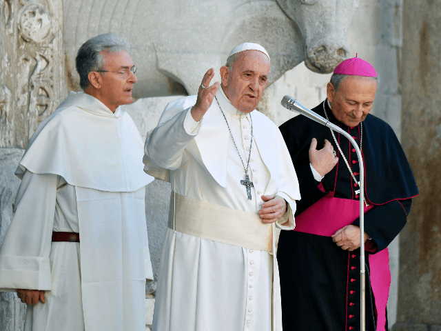 Pope Francis (C) speaks prior to leaving, along with Archbishop of Bari-Bitonto, Francesco Cacucci (R) and priest Giovanni Distante, the Basilica pontificia di San Nicola after a meeting with bishops during a visit to Bari, southern Italy, on February 23, 2020 to address a conference entitled "Mediterranean: Frontier of Peace" …