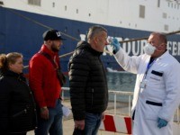 Medical staff check incoming passengers coming from Italy to detect any possible symptoms of Covid-19 also known as Coronavirus at Albanias main port city of Durres on February 26, 2020. - With the outbreak of Covid-19 in Italy, Albania that has very close trade links and daily ferries and multiple …