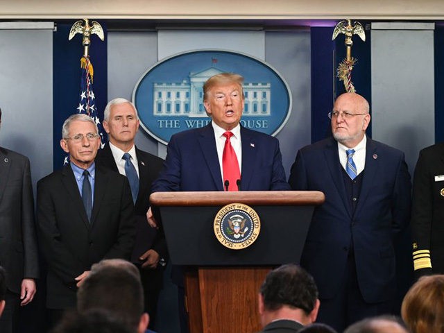 US President Donald Trump (C) speaks at a news conference with members of the Centers for Disease Control and Prevention(CDC) on the COVID-19 outbreak at the White House in Washington, DC on February 29, 2020. - The number of novel coronavirus cases in the world rose to 85,919, including 2,941 …