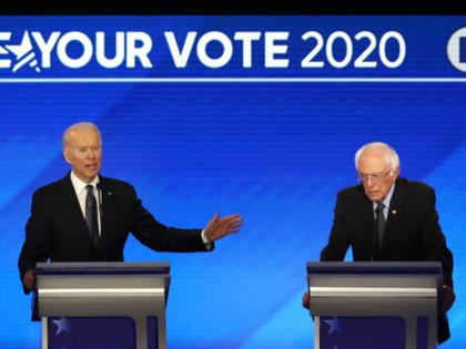 MANCHESTER, NEW HAMPSHIRE - FEBRUARY 07: (L-R) Democratic presidential candidates Sen. Elizabeth Warren (D-MA), former Vice President Joe Biden and Sen. Bernie Sanders (I-VT) participate in the Democratic presidential primary debate in the Sullivan Arena at St. Anselm College on February 07, 2020 in Manchester, New Hampshire. Seven candidates qualified …