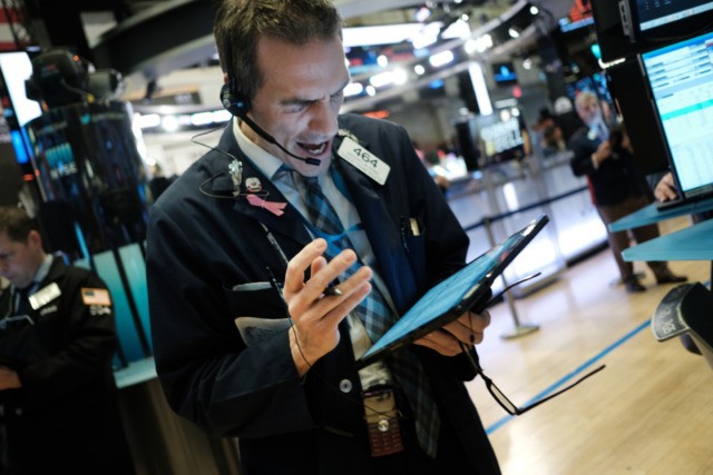 NEW YORK, NEW YORK - FEBRUARY 24: Traders work on the floor of the New York stock Exchange (NYSE) on on February 24, 2020 in New York City. Stocks fell over 1000 points on Monday as global concerns grow about the economic impact of the Coronavirus. (Photo by Spencer Platt/Getty …