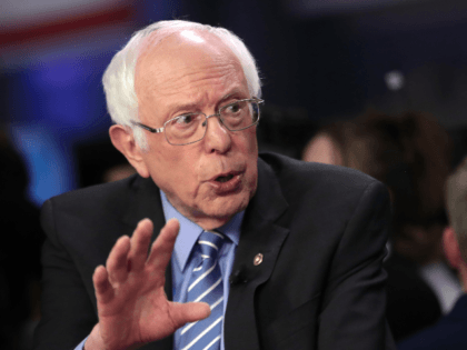 Democratic presidential candidate Sen. Bernie Sanders (I-VT) speaks to media in the spin r