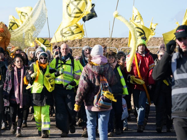 CONSETT, ENGLAND - FEBRUARY 27: Extinction Rebellion demonstrators are escorted out of the Bradley Open Cast coal mine after gaining access earlier in the day on February 27, 2020 in Consett, England. The ‘We are the Dead Canaries’ action is the first of many during a planned 40 Days of …