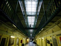 LONDON - MAY 19: NOTE TO EDITOR: THIS IMAGE IS EMBARGOED UNTIL 0001 HOURS (GMT) MAY 20, 2003. Prisoners at HMP (Her Majesty's Prison) Pentonville walk through an atrium May 19, 2003 in London. The Chief inspector of prisons Anne Owers will, in a report publishing her unannounced follow-up inspection …