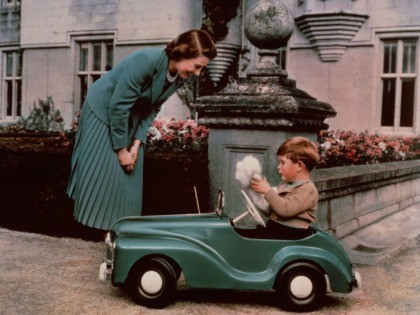 28th September 1952: Princess Elizabeth watching her son Prince Charles playing in his toy car while at Balmoral. (Photo by Lisa Sheridan/Studio Lisa/Getty Images)