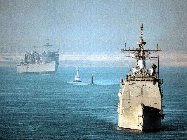 The USS Normandy (Front), the submarine USS Annapolis (Center), and the support ship USS S