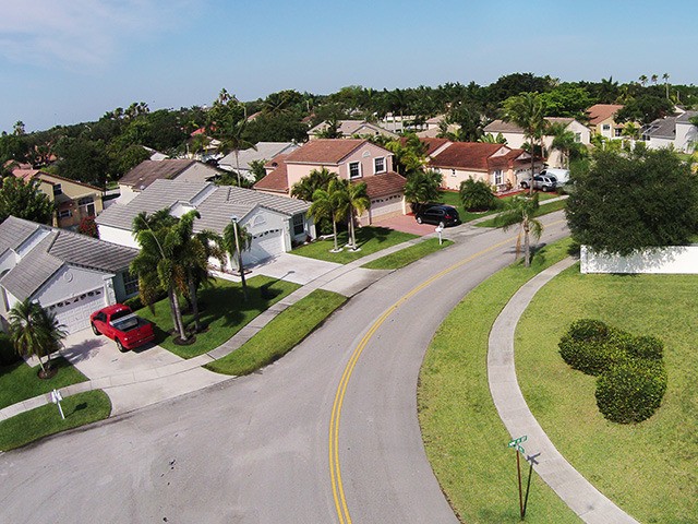 Middle class neighborhood street in Florida aerial view