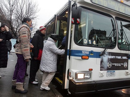 NEW YORK - DECEMBER 16: Commuters wait to board a Metropolitan Transit Authority (MTA) bus on 14th Street during the morning rush-hour December 16, 2005 in New York City. Transit workers continue to negotiate a contract with the Metropolitan Transit Authority while calling for a selective private bus line strike. …