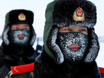 TOPSHOT - Chinese paramilitary police border guards train in the snow at Mohe County in China's northeast Heilongjiang province, on the border with Russia, on December 12, 2016. Mohe is the northernmost point in China, with a sub arctic climate where border guards operate in temperatures as low as -36 …