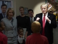 US President Donald Trump speaks to fourth grade students as he tours Saint Andrew Catholic School in Orlando, Florida, on March 3, 2017, with Education Secretary Betsy DeVos (2nd L), White House senior adviser Jared Kushner (L) and Kushner's wife Ivanka Trump. / AFP PHOTO / NICHOLAS KAMM (Photo credit …
