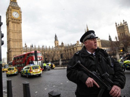 LONDON, ENGLAND - MARCH 22: An armed police officer stands guard near Westminster Bridge and the Houses of Parliament on March 22, 2017 in London, England. A police officer has been stabbed near to the British Parliament and the alleged assailant shot by armed police. Scotland Yard report they have …