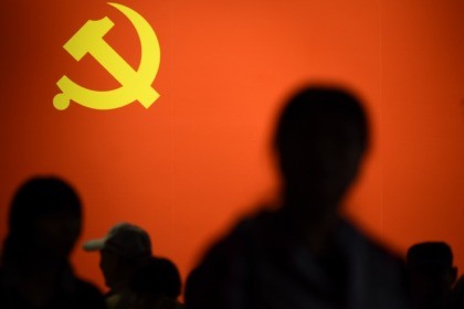 TOPSHOT - This picture taken on October 10, 2017 shows a party flag of the Chinese Communist Party displayed at an exhibition showcasing China's progress in the past five years at the Beijing Exhibition Center. China's police and censorship organs have kicked into high gear to ensure that the party's …