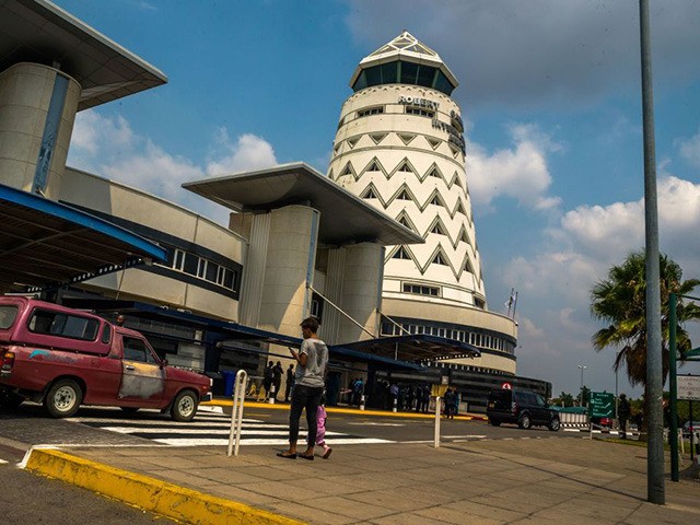 People walk by main terminals at the country's main international airport in Harare, Zimba
