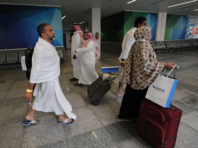 Muslim pilgrims go through passport control upon their arrival at Jeddah airport on July 14,2018, prior to the start of the annual Hajj pilgrimage in the holy city of Mecca. - The Hajj, the largest annual pilgrimage in the world, is the fifth pillar of Islam, a religious duty that …