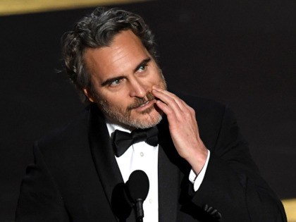 HOLLYWOOD, CALIFORNIA - FEBRUARY 09: Joaquin Phoenix accepts the Actor In A Leading Role a