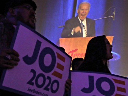 LAS VEGAS, NEVADA - FEBRUARY 15: Supporters hold signs as Democratic presidential candidate former Vice President Joe Biden speaks during the Clark County Democrats Kick Off to Caucus Gala at Tropicana Las Vegas February 15, 2020 in Las Vegas, Nevada. The first time in the history, Nevadans have the option …