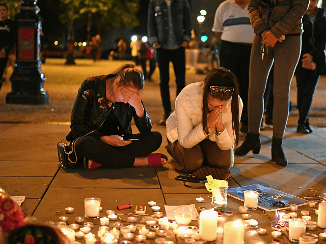MANCHESTER, ENGLAND - MAY 23: Members of the public attend a candlelit vigil, to honour the victims of Monday evening's terror attack, at Albert Square on May 23, 2017 in Manchester, England. Monday's explosion occurred at Manchester Arena as concert goers were leaving the venue after Ariana Grande had just …
