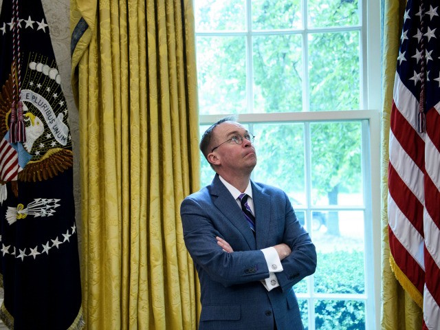 White House acting Chief of Staff Mick Mulvaney listens while US President Donald Trump sp