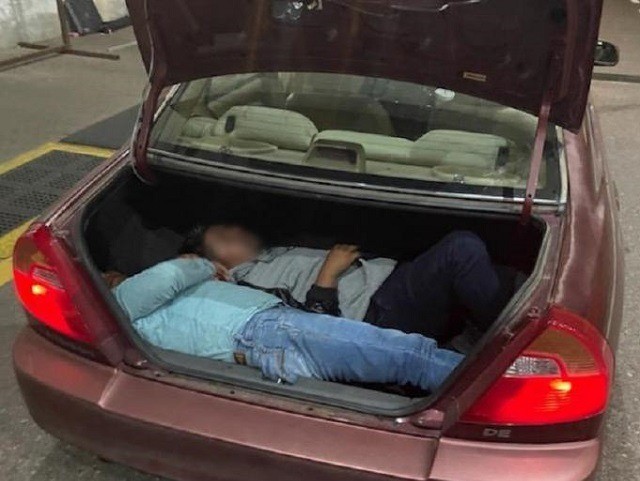 Border Patrol agents find two Mexican nationals locked in the trunk of a smuggler's vehicl