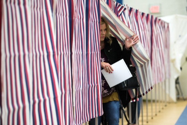 CONCORD, NH - FEBRUARY 11: A voter exits the voting booth after filling out their ballot at the Broken Ground School during the presidential primary on February 11, 2020 in Concord, New Hampshire. (Photo by Scott Eisen/Getty Images)
