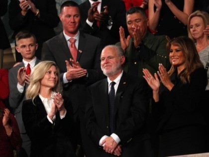 Rush Limbaugh reacts as first Lady Melania Trump, and his wife Kathryn, applaud, as President Donald Trump delivers his State of the Union address to a joint session of Congress on Capitol Hill in Washington, Tuesday, Feb. 4, 2020. (Leah Millis/Pool via AP)
