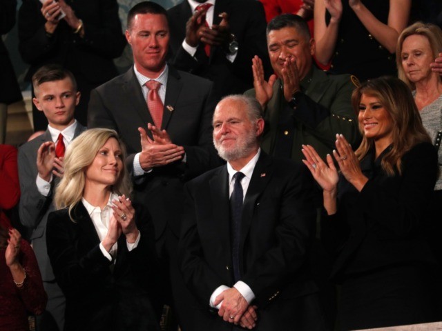 Rush Limbaugh reacts as first Lady Melania Trump, and his wife Kathryn, applaud, as Presid